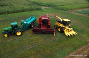 Gurukul Agriculture Machineries : Table of Contents - From left to right- John Deere 7800 tractor with Houle slurry trailer, Case IH combine harvester, New Holland FX 25 forage harvester with corn head.